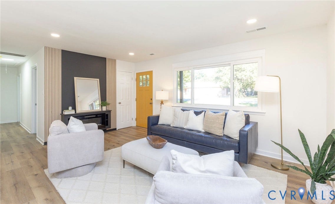 6015 Seaman Road, Westover, Richmond, VA 23225 Expansive living area with wood-finish flooring, recessed lighting, and a decorative accent wall