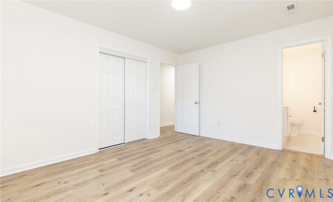 6015 Seaman Road, Westover, Richmond, VA 23225 Wood-finish flooring, white walls, and a ceiling-mounted light fixture