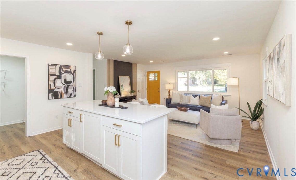 6015 Seaman Road, Westover, Richmond, VA 23225 Kitchen island with white cabinetry and gold-tone hardware, two clear glass pendant lights, recessed ceiling lighting, and wood-finish flooring
