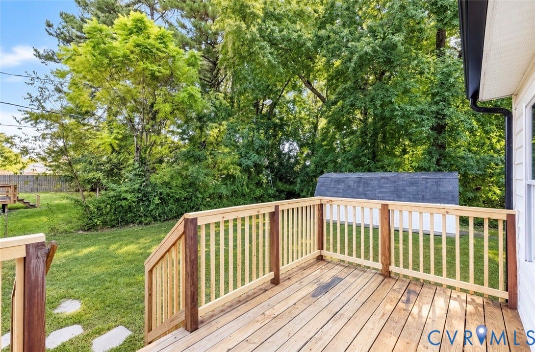 6015 Seaman Road, Westover, Richmond, VA 23225 Wood deck with natural wood railings, expansive green lawn, and mature trees