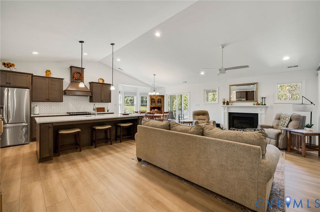 11804 Rydal Way, Cobbs Creek, Glen Allen, VA 23059 Vaulted ceilings, wood-finish flooring, and a stone-surround fireplace with a classic mantel