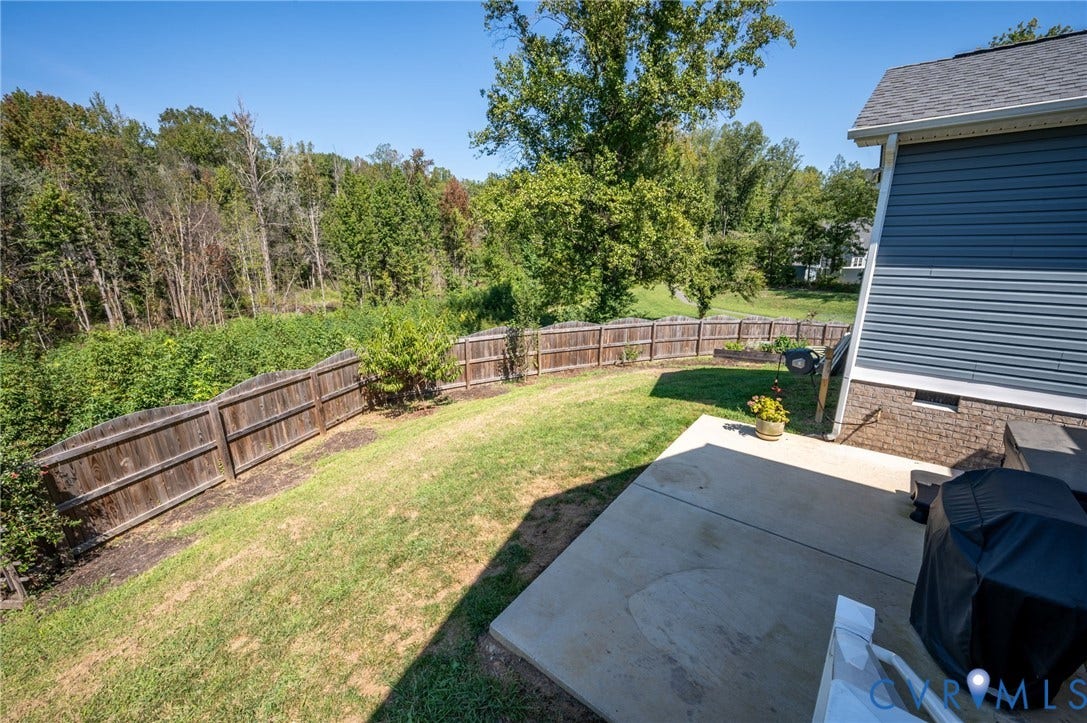 11804 Rydal Way, Cobbs Creek, Glen Allen, VA 23059 Expansive backyard featuring a privacy fence, concrete patio, and mature trees