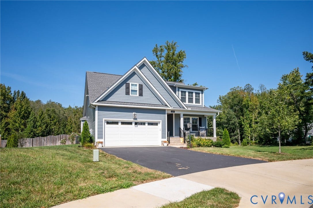 11804 Rydal Way, Cobbs Creek, Glen Allen, VA 23059 Contemporary residence featuring blue siding, white trim, an attached two-car garage, and a covered front porch with dark railings
