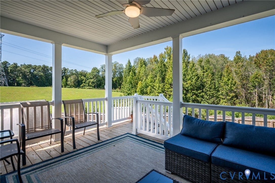 11804 Rydal Way, Cobbs Creek, Glen Allen, VA 23059 Covered deck with a ceiling fan, white balustrade, wood-finish decking, and an expansive natural landscape