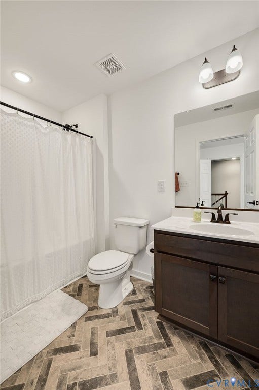 11804 Rydal Way, Cobbs Creek, Glen Allen, VA 23059 Bathroom featuring a dark wood-finish vanity, white countertop, and patterned tile flooring