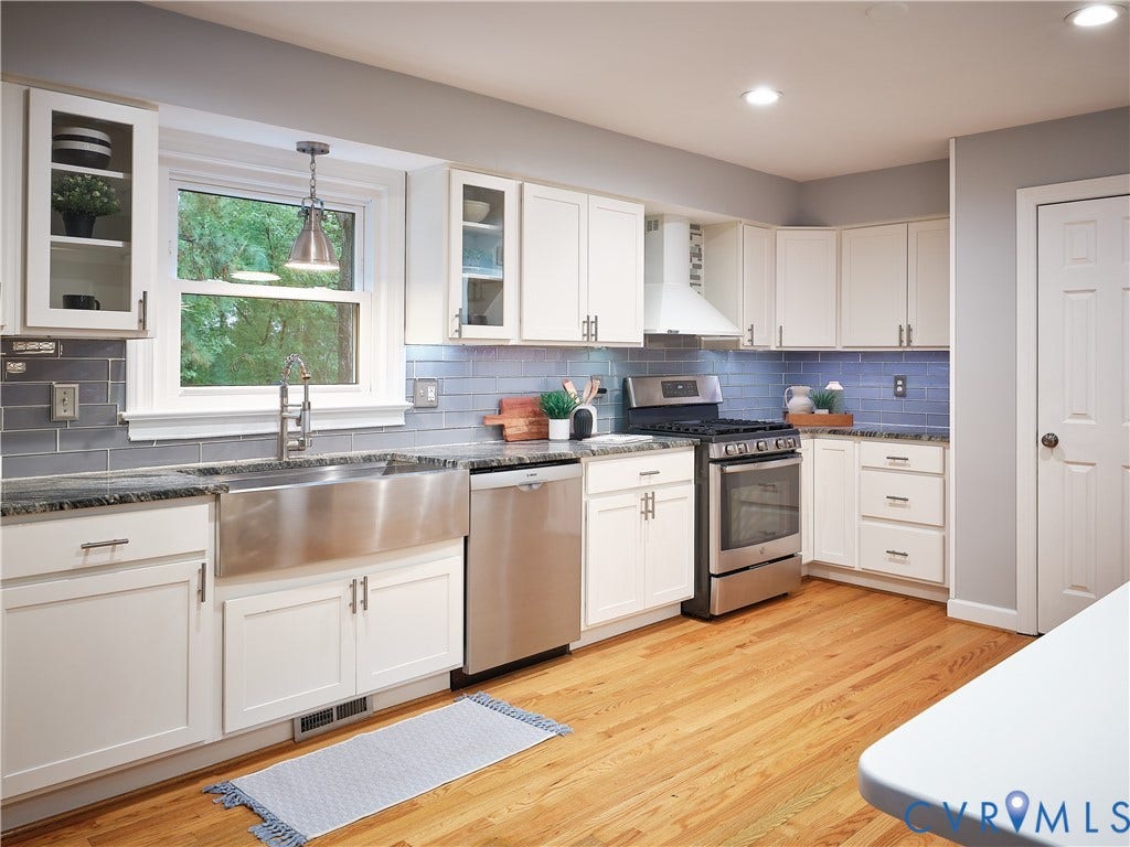 1708 Windingridge Court, Henrico, VA 23238 Glazed subway tiles and a custom hood, plus newer appliances make up the remodeled kitchen.