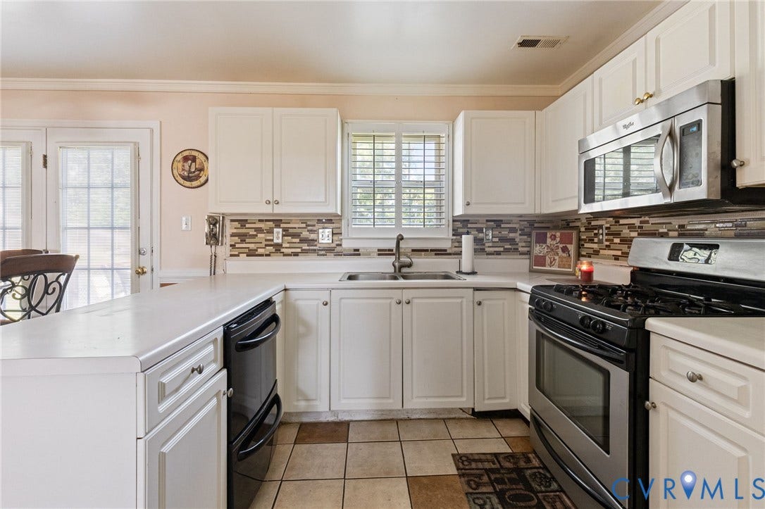 14119 Kentwood Forest Drive, Kentwood Forest, Chester, VA 23831 White cabinetry, stainless steel appliances, tile backsplash and tile flooring