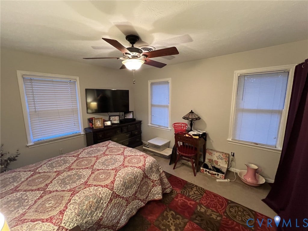 8336 Devils Den Lane, Mechanicsville, VA 23111 Neutral-toned walls featuring multiple windows with blinds, and a ceiling fan with integrated lighting