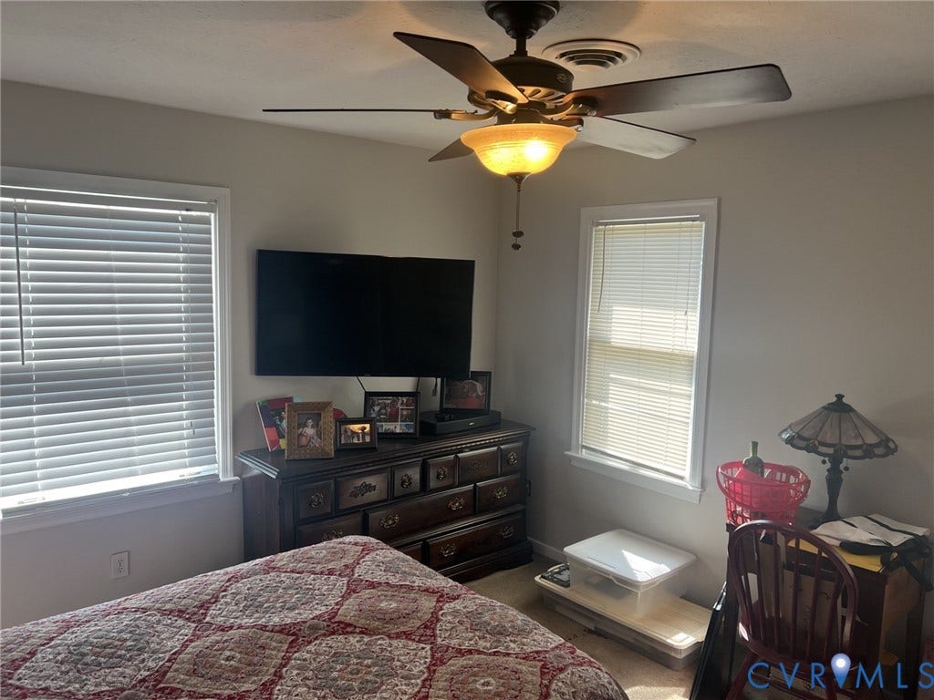 8336 Devils Den Lane, Mechanicsville, VA 23111 Ceiling fan with integrated lighting, two windows with blinds, light-toned walls