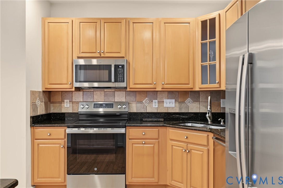 Kitchen Featuring Electric Oven and Cooktop.