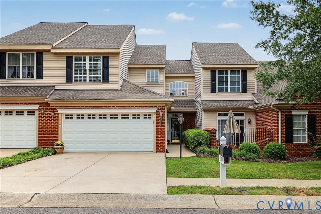 Beautifully Landscaped Front Yard - Maintenance Free + an Attached 2-Car Garage.