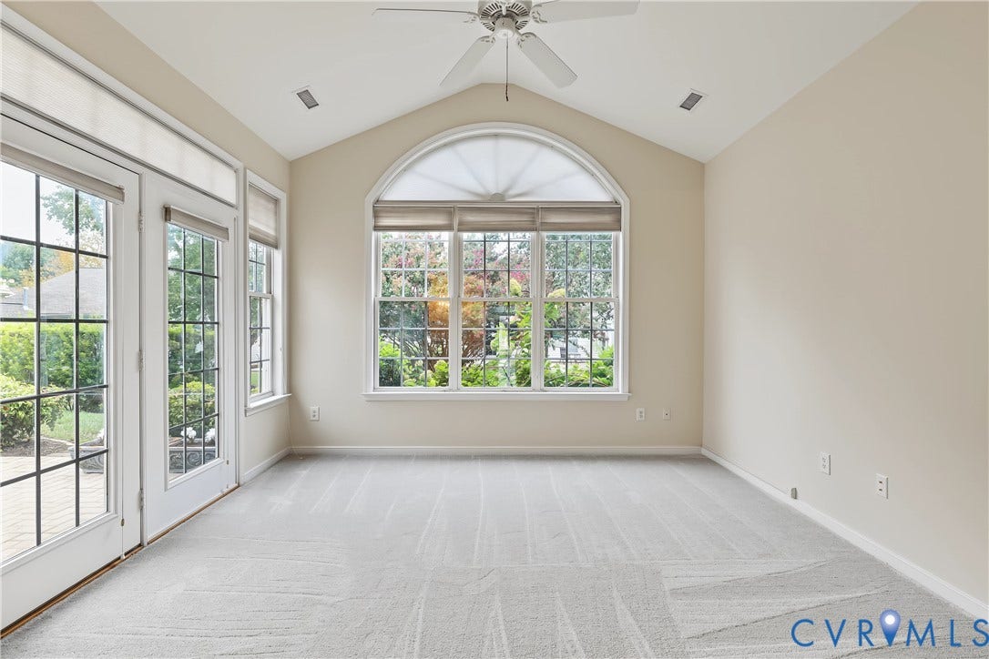 Florida Room Featuring Carpet, Vaulted Ceiling, Ceiling Fan, and Palladium Windows.