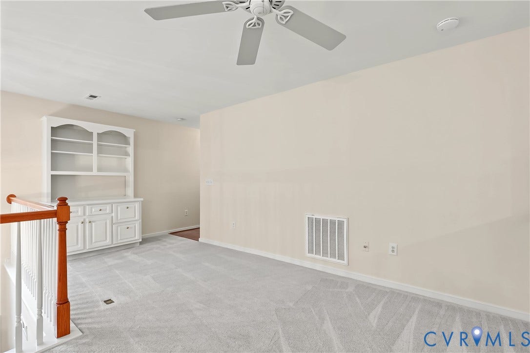 2nd Floor Loft Featuring Carpet and Ceiling Fan.