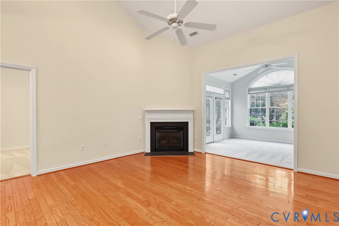 Living Room Leads to Sunny Florida Room.