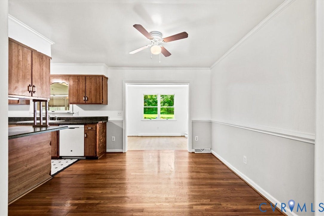 13012 Harrowgate Road, Chesterfield, VA 23831 Hardwood-finish flooring throughout, crown molding, chair rail detailing, recessed sink, and an overhead ceiling fan with light fixture