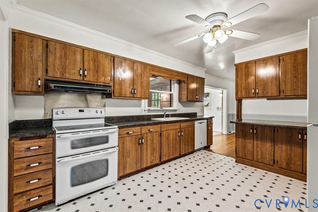13012 Harrowgate Road, Chesterfield, VA 23831 Kitchen featuring wood-finish cabinetry, black countertops, a double-oven range, a built-in dishwasher, and a ceiling fan with integrated lighting