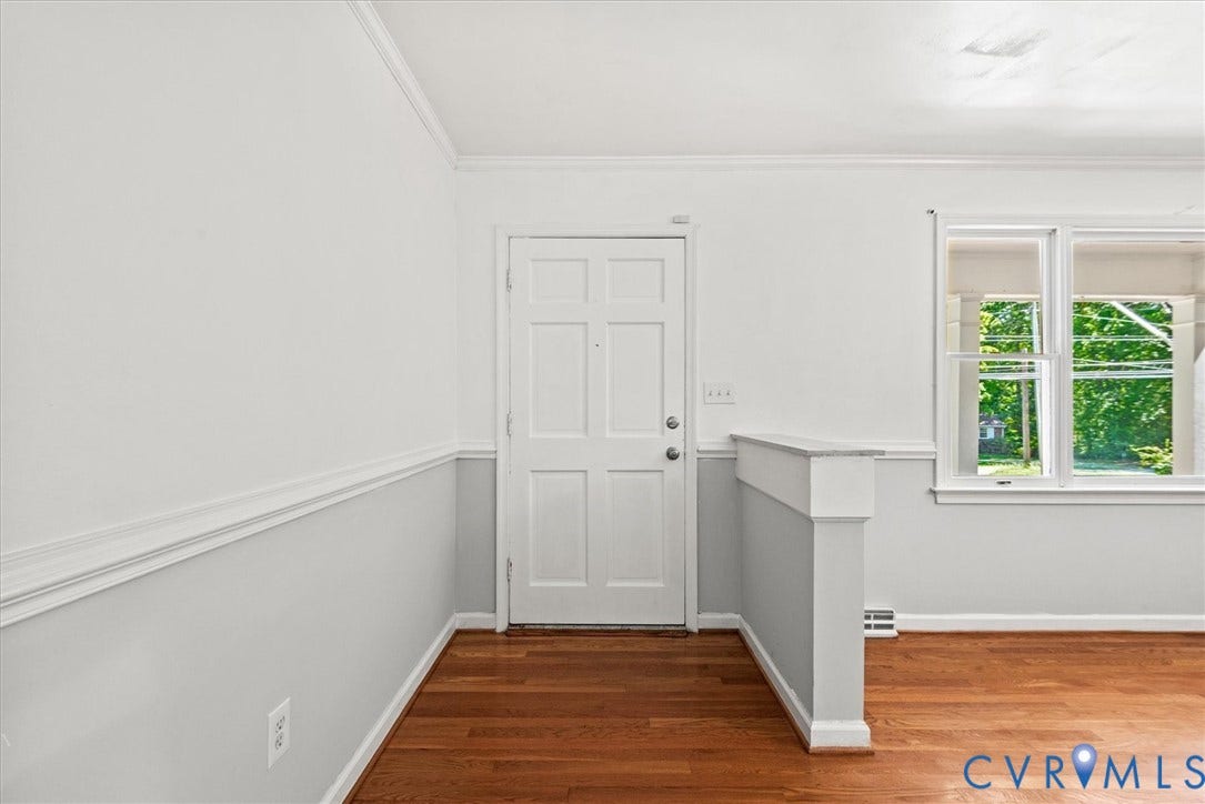 13012 Harrowgate Road, Chesterfield, VA 23831 Wood-finish flooring, paneled entry door, chair rail molding, crown molding, and a double window with trim