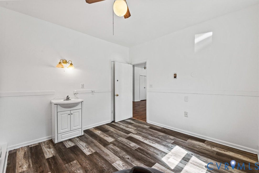 13012 Harrowgate Road, Chesterfield, VA 23831 Wood-finish flooring with white baseboards and light wall paint