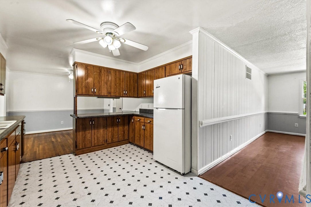 13012 Harrowgate Road, Chesterfield, VA 23831 Kitchen featuring wood cabinetry, dark countertops, and a ceiling fan with light fixture