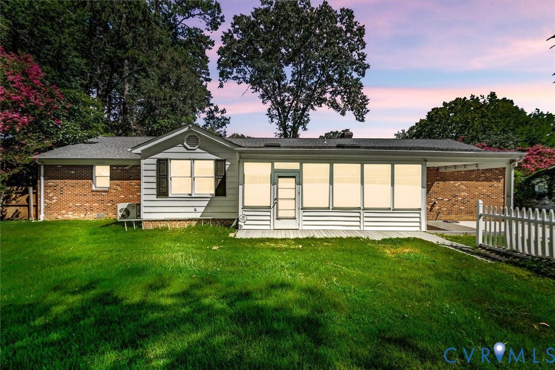13012 Harrowgate Road, Chesterfield, VA 23831 Brick and siding exterior with a sunroom, covered carport, and a white picket fence