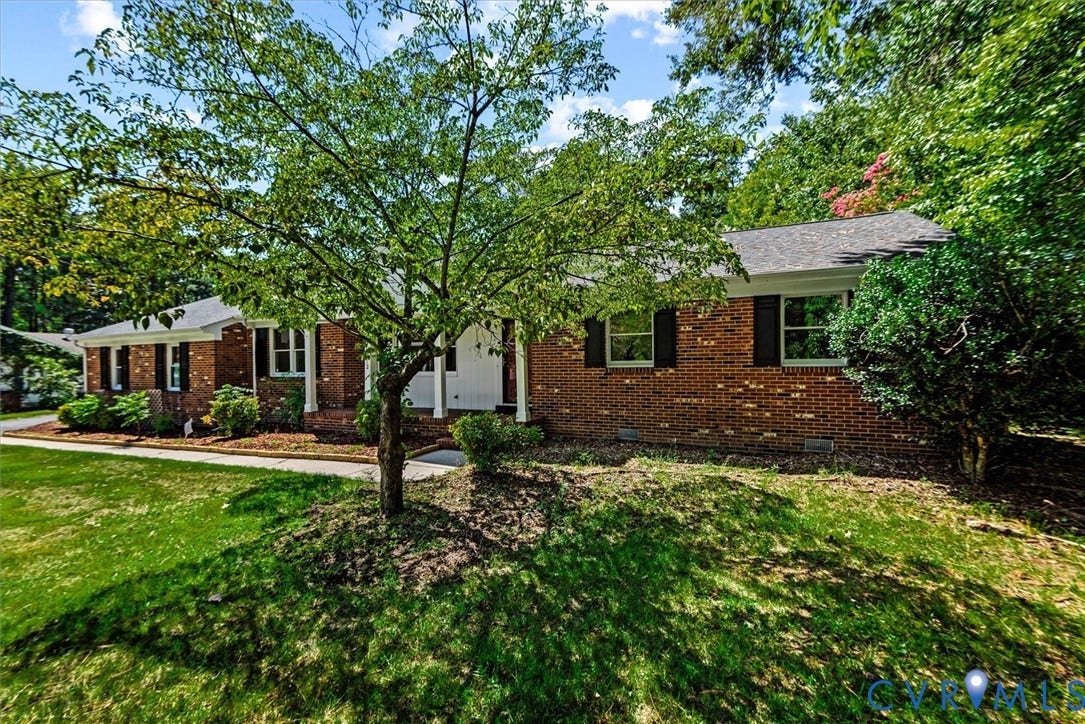 13012 Harrowgate Road, Chesterfield, VA 23831 Red brick exterior with white trim, black window shutters, and a gray shingle roof