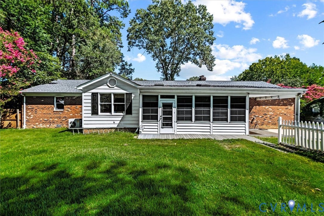 13012 Harrowgate Road, Chesterfield, VA 23831 Expansive rear yard featuring a manicured lawn, brick and siding exterior, screened porch, and white picket fencing