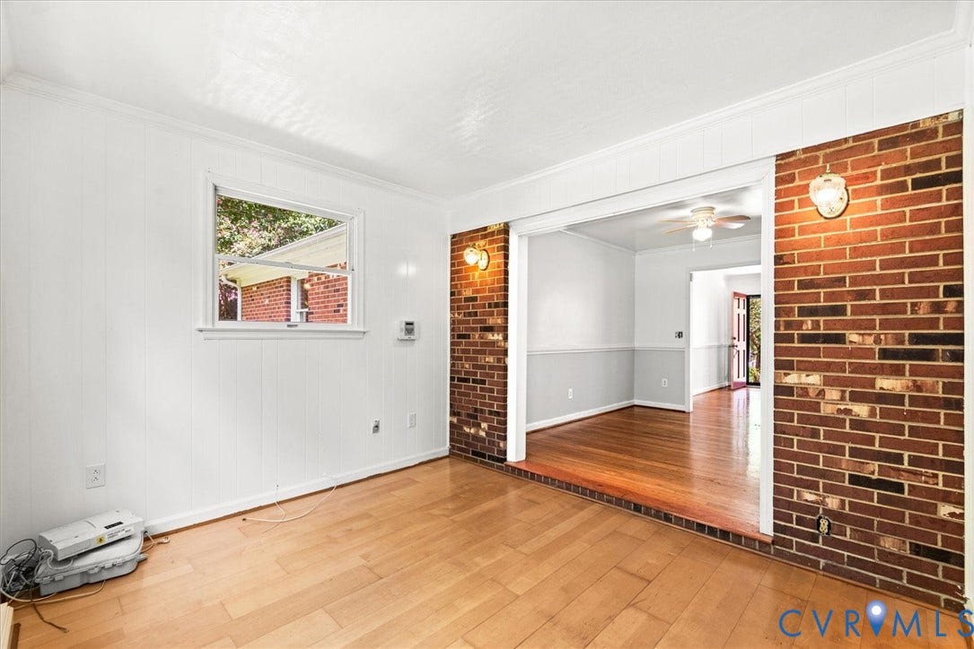 13012 Harrowgate Road, Chesterfield, VA 23831 Hardwood flooring throughout, brick accent walls, and a window with natural light