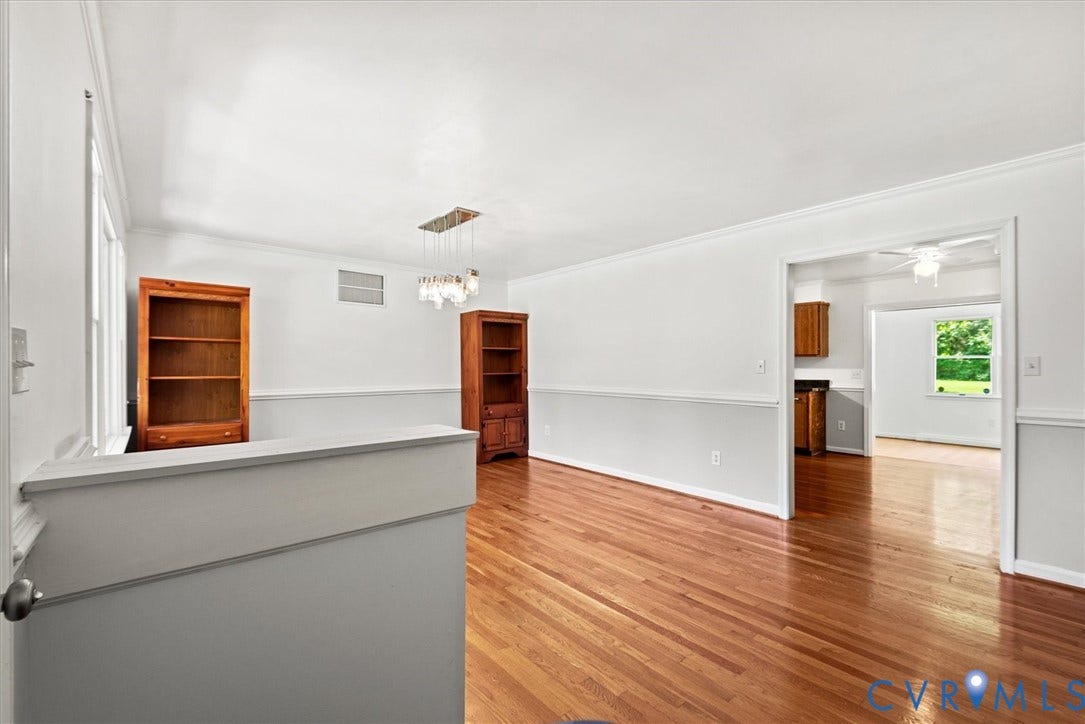 13012 Harrowgate Road, Chesterfield, VA 23831 Hardwood flooring throughout, crown molding, chair rail detailing, recessed lighting, and a contemporary chandelier