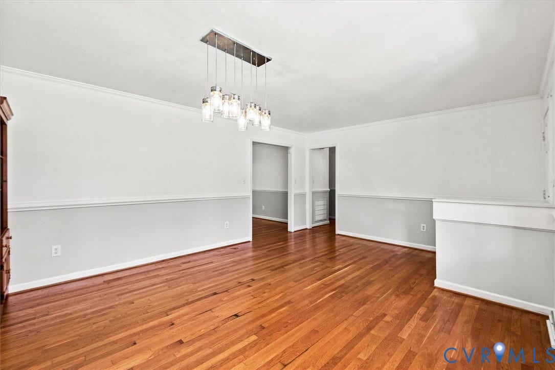 13012 Harrowgate Road, Chesterfield, VA 23831 Hardwood flooring, crown molding, chair rail molding, and a modern rectangular chandelier with multiple lights