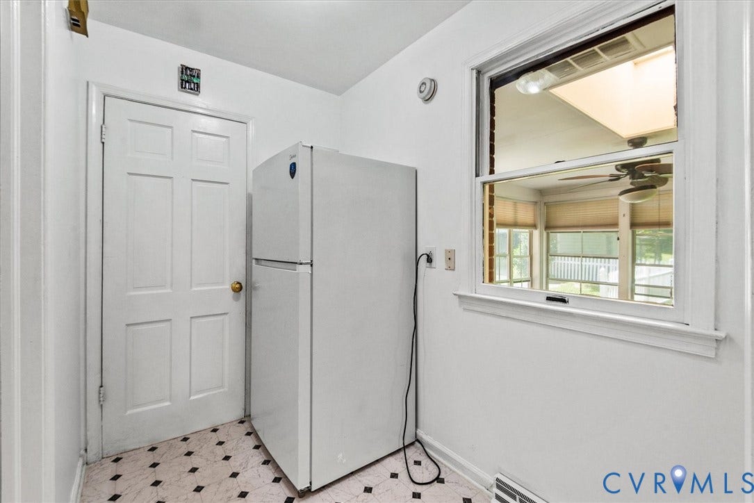 13012 Harrowgate Road, Chesterfield, VA 23831 White paneled door, white trim window, and patterned tile flooring