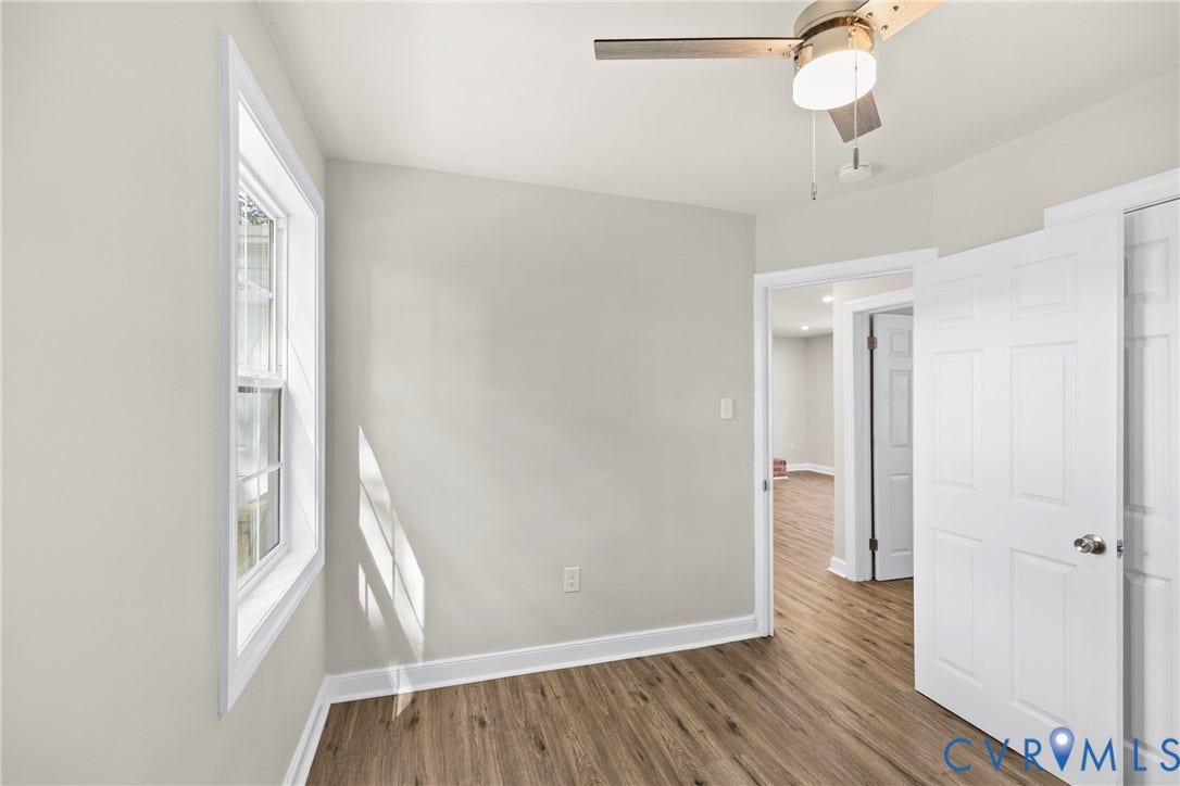 606 Effingham Drive, Woodhaven, Richmond, VA 23224 Neutral wall color with wood-finish flooring, white trim, and a ceiling fan
