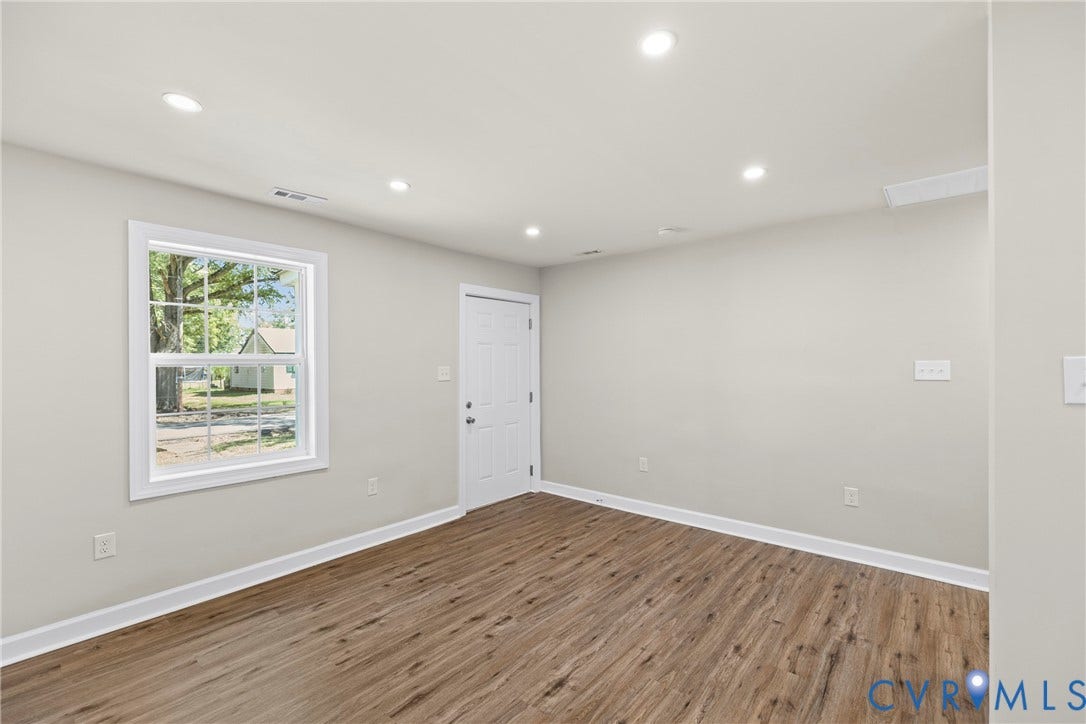 606 Effingham Drive, Woodhaven, Richmond, VA 23224 Recessed lighting, wood-finish flooring, white trim, and a white paneled door