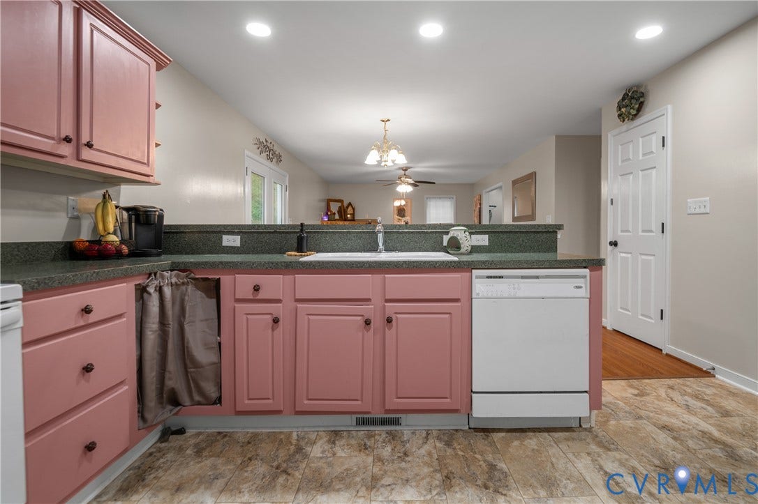 Recessed lighting, wood-finish flooring, white paneled interior door, built-in dishwasher, and a double-basin sink