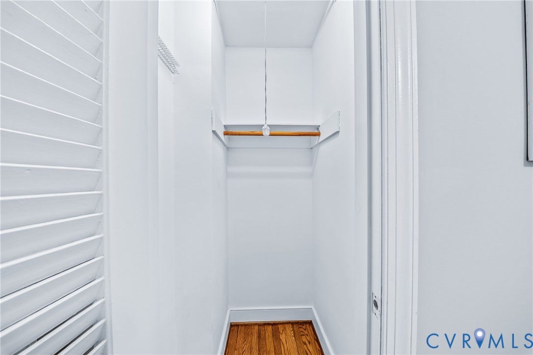 7548 Piney Branch Road, Stratford Hills, Richmond, VA 23225 Closet with built-in wooden rod and shelf, hardwood flooring, and louvered door