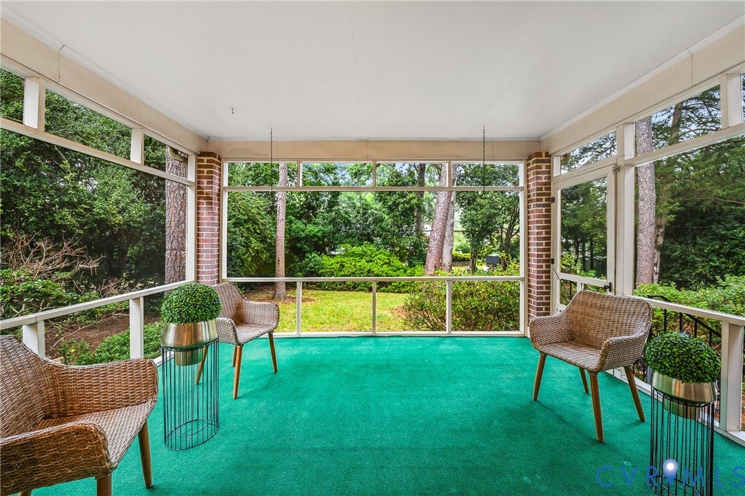 7548 Piney Branch Road, Stratford Hills, Richmond, VA 23225 Screened porch with brick accents, bright green flooring, and white railing