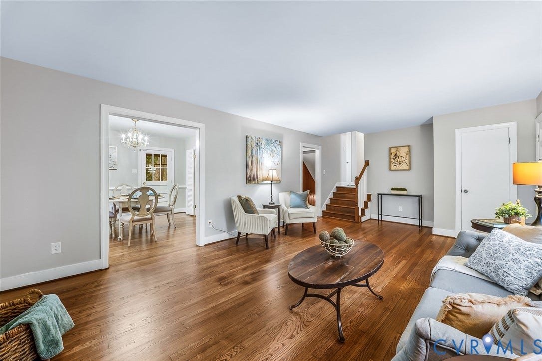 7548 Piney Branch Road, Stratford Hills, Richmond, VA 23225 Hardwood flooring, painted walls, open archway, and wood staircase with white risers