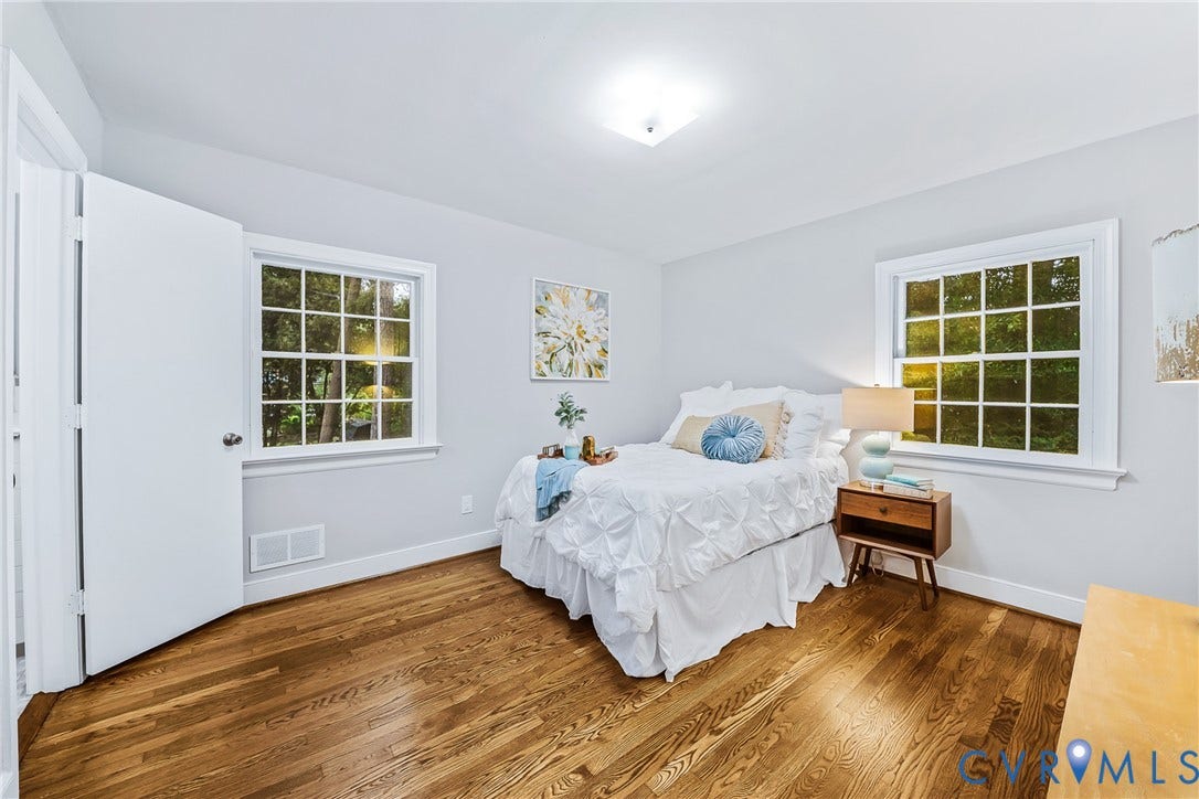 7548 Piney Branch Road, Stratford Hills, Richmond, VA 23225 Hardwood flooring, two large windows, white trim, light wall color, ceiling-mounted light fixture