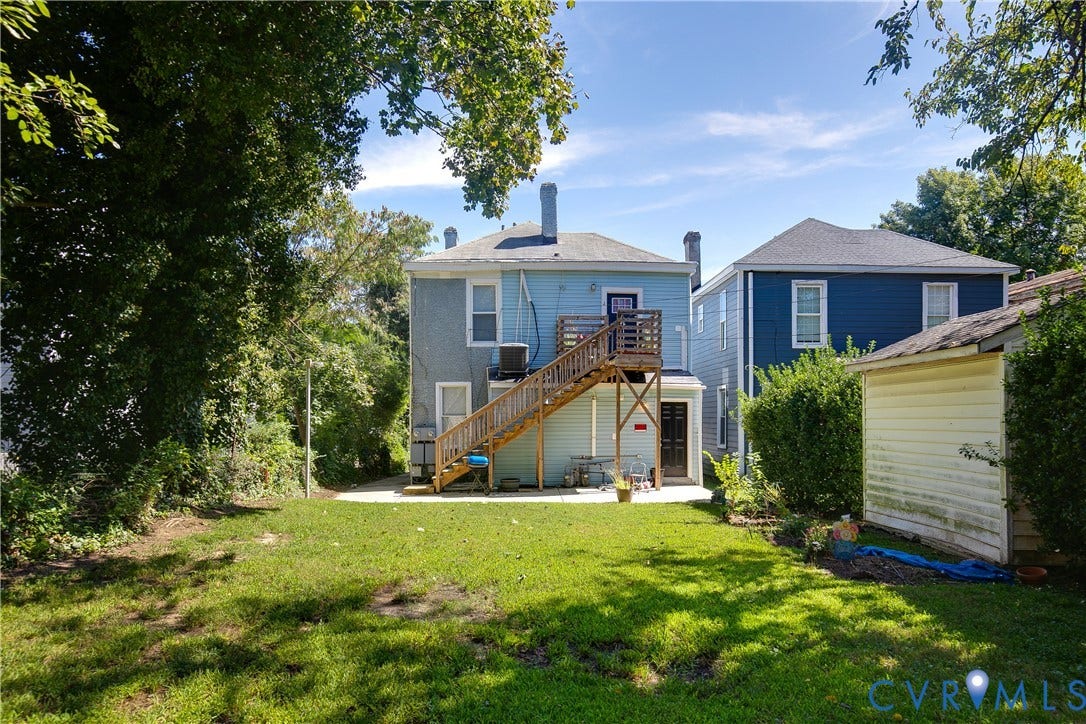 3314 3rd Avenue, Northside, Richmond, VA 23222 Expansive green space featuring a concrete patio, wooden deck, and a detached shed