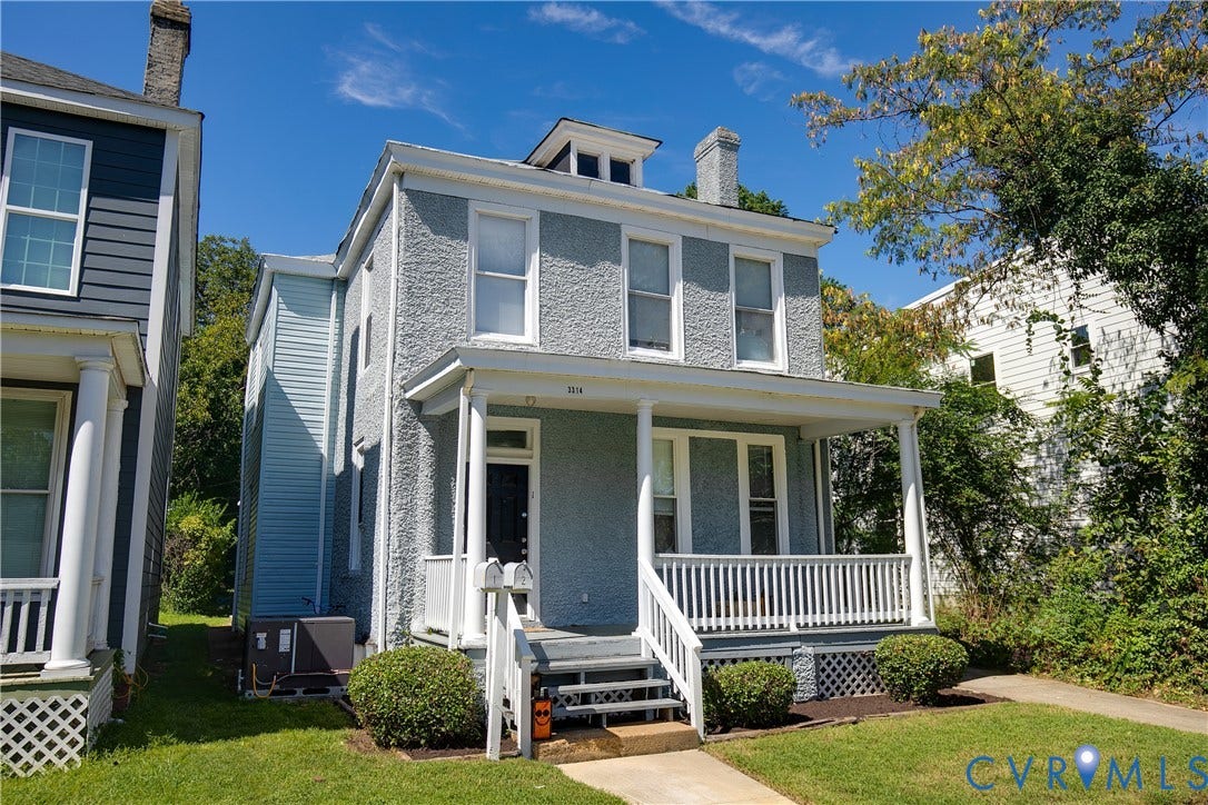 3314 3rd Avenue, Northside, Richmond, VA 23222 Classic Colonial-style residence featuring a light brick exterior with substantial front porch and white railing detail