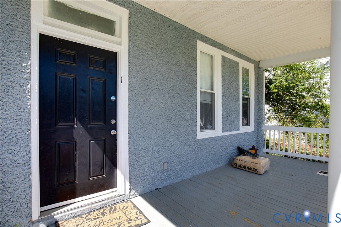 3314 3rd Avenue, Northside, Richmond, VA 23222 Covered porch with wood flooring, white railing, and paneled entry door with transom window