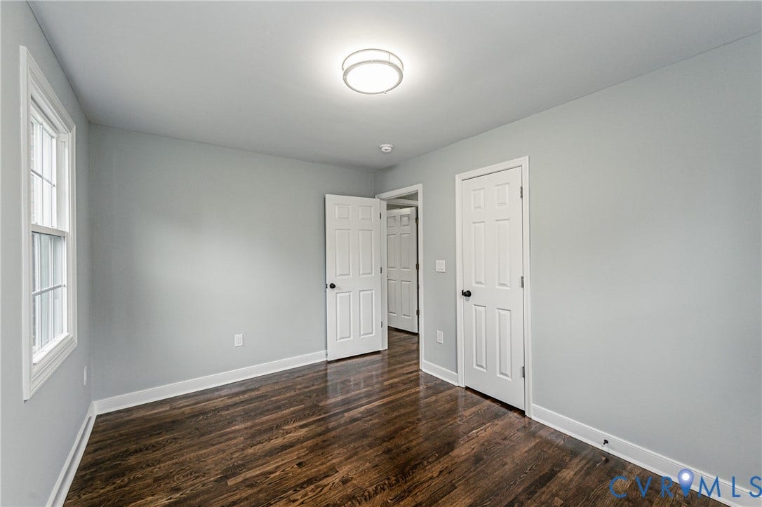 1608 Bryan Street, Richmond, VA 23223 Hardwood flooring, light gray wall finishes, white trim, recessed lighting, and white paneled doors