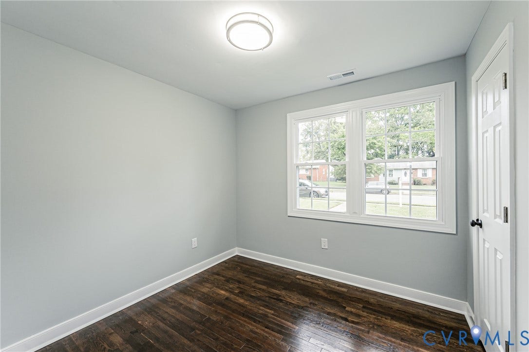 1608 Bryan Street, Richmond, VA 23223 Wood-finish flooring, white trim, recessed ceiling light, and double-hung windows