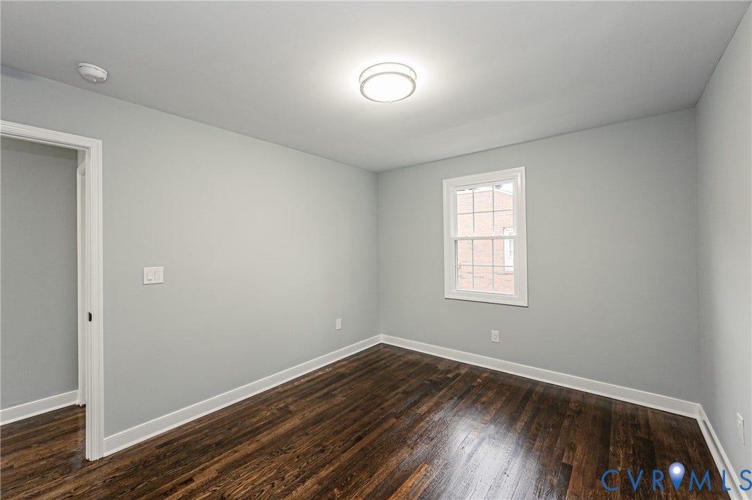 1608 Bryan Street, Richmond, VA 23223 Hardwood flooring, painted walls, white trim, recessed window, and flush mount lighting