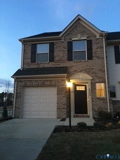 4200 Rosedown Place, #Y-E, Henrico, VA 23223 Brick facade with black shutters, attached single-car garage, concrete driveway, and covered entry