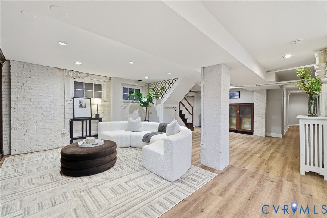 1848 W Grace Street, Historic W. Grace Street, Richmond, VA 23220 Recessed lighting, painted brick walls, wood-finish flooring, built-in cabinetry, and a white lattice partition