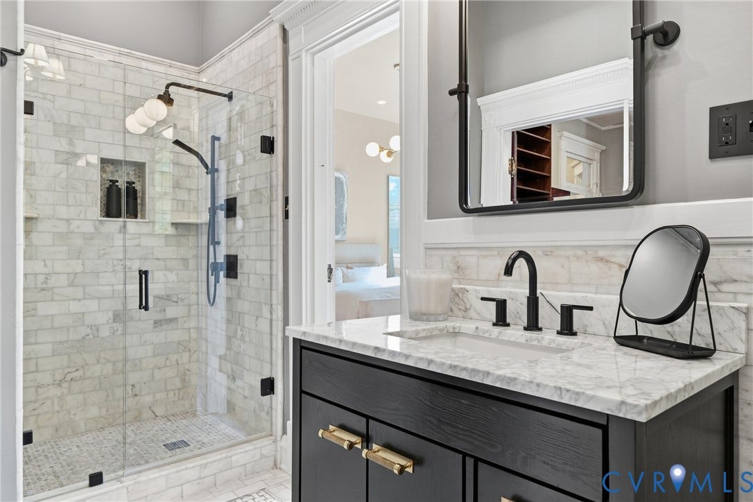 1848 W Grace Street, Historic W. Grace Street, Richmond, VA 23220 Glass-enclosed shower with subway tile surround, built-in shelving, and dual shower heads
