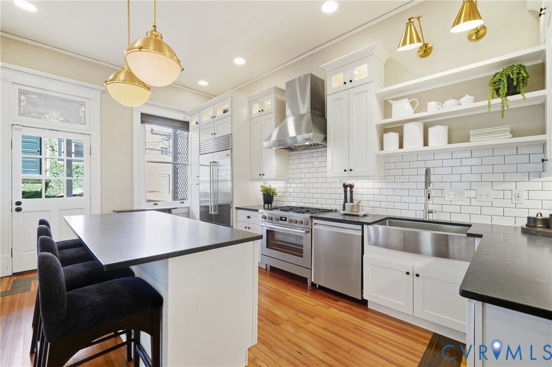 1848 W Grace Street, Historic W. Grace Street, Richmond, VA 23220 Kitchen featuring white cabinetry, stainless steel appliances, wood-finish flooring, a white subway tile backsplash, and dark countertops
