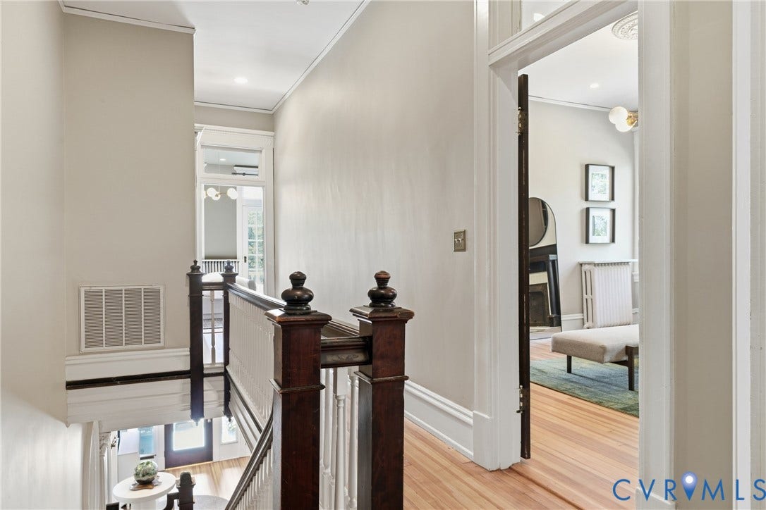 1848 W Grace Street, Historic W. Grace Street, Richmond, VA 23220 Hardwood flooring, classic white trim, and ornate stair balusters