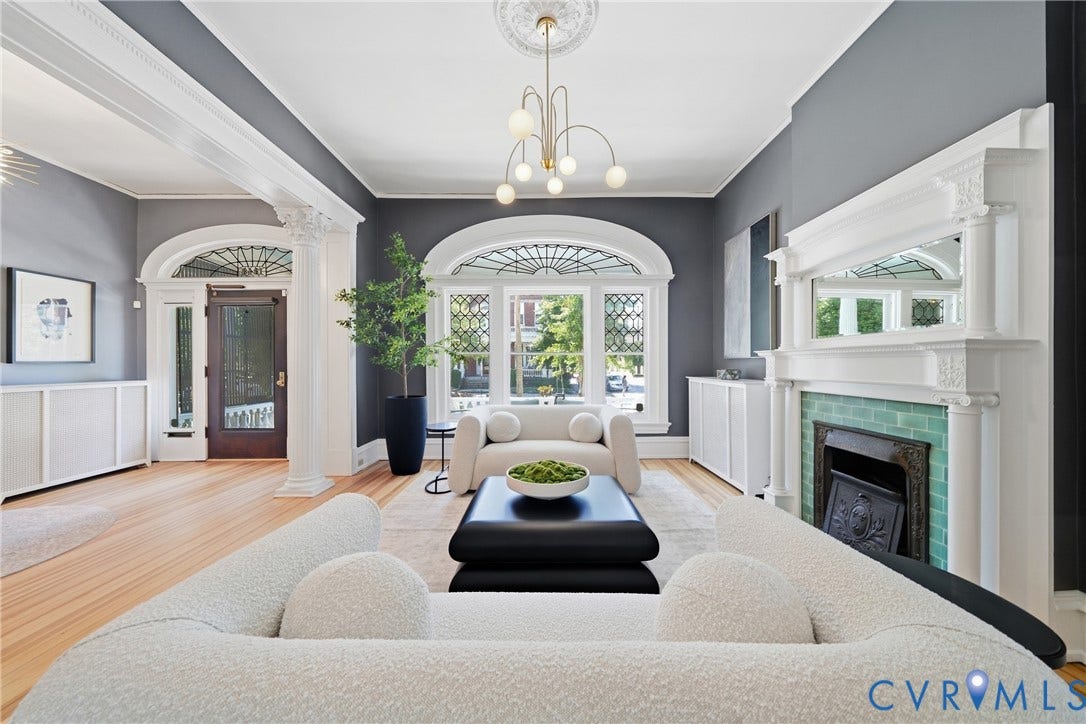1848 W Grace Street, Historic W. Grace Street, Richmond, VA 23220 Wood-finish flooring, decorative ceiling medallion, ornate fireplace mantel with green tiled surround, and arched windows with intricate leaded glass