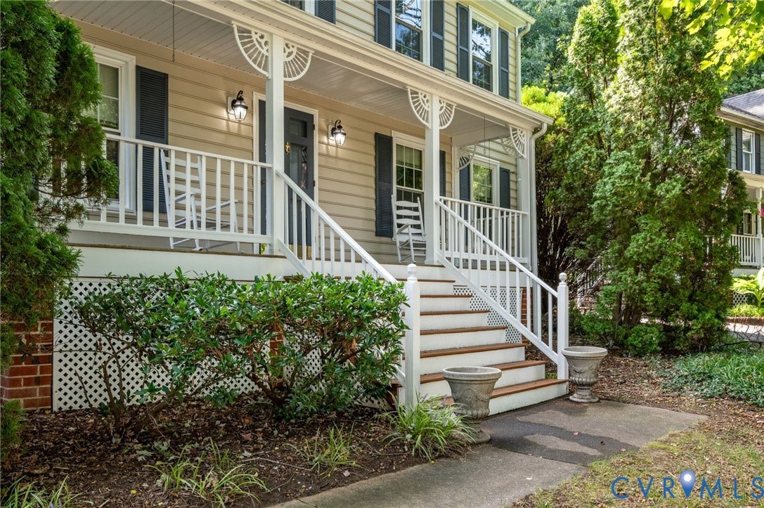 3005 Wiltonshire Drive, Richmond, VA 23233 Covered porch with white railings, a dark paneled entry door, and decorative porch brackets